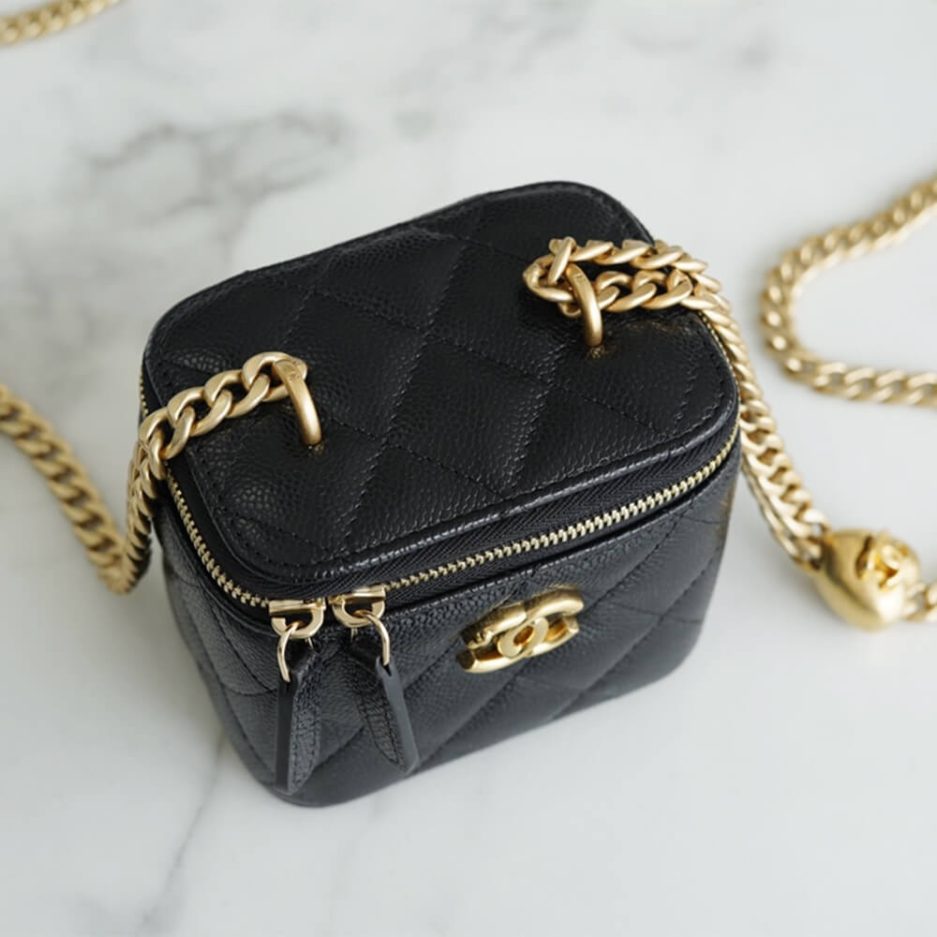 Ch*el small gold ball makeup bag